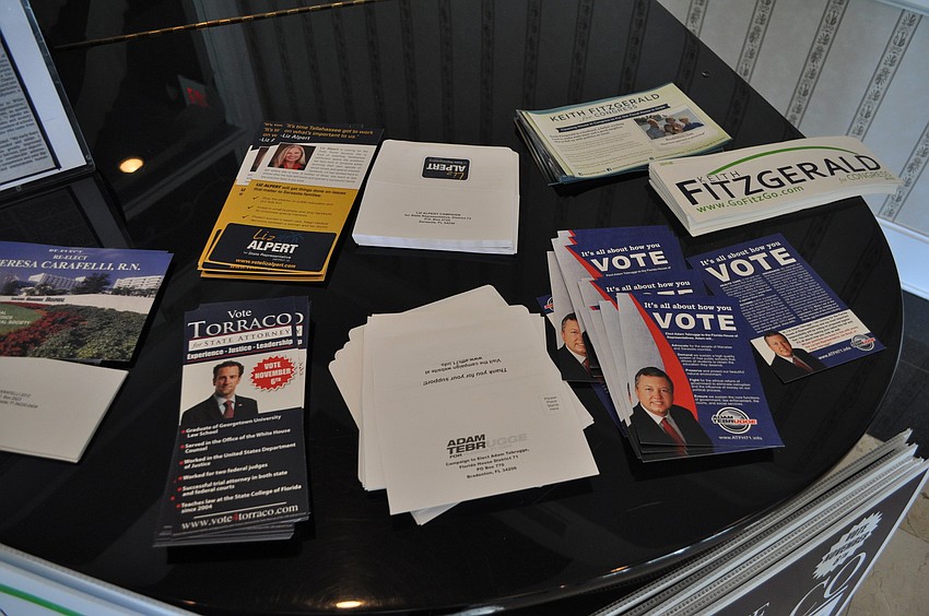 A variety of flyers and election paraphernalia was on top of the piano at the Longboat Key Harbourside Dining Room Tuesday, Oct. 9.