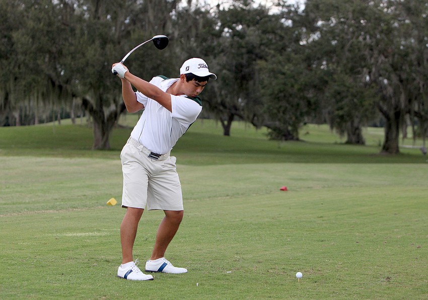 Seiya Lui, 15, of St. Stephenâ€™s, prepares to hit the ball off the tee at the first hole.