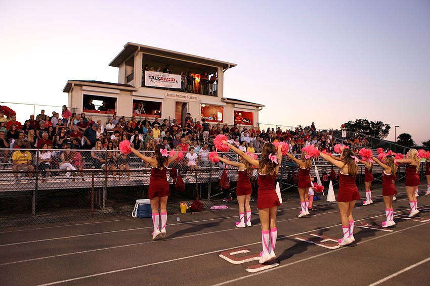 The cougar cheerleaders pump up the crowd Friday, Oct. 12.