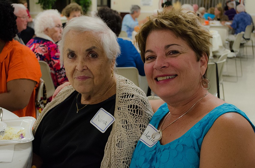 Michelle sits with her mother Norma Costanzi at the celebration.