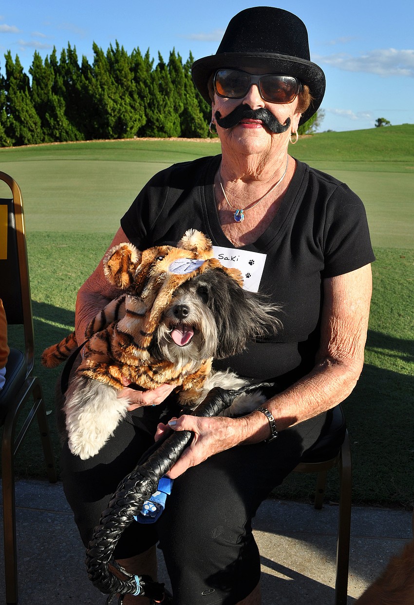 Dotty House and Saki, 2 Â½, dressed up as a ringmaster and tiger.