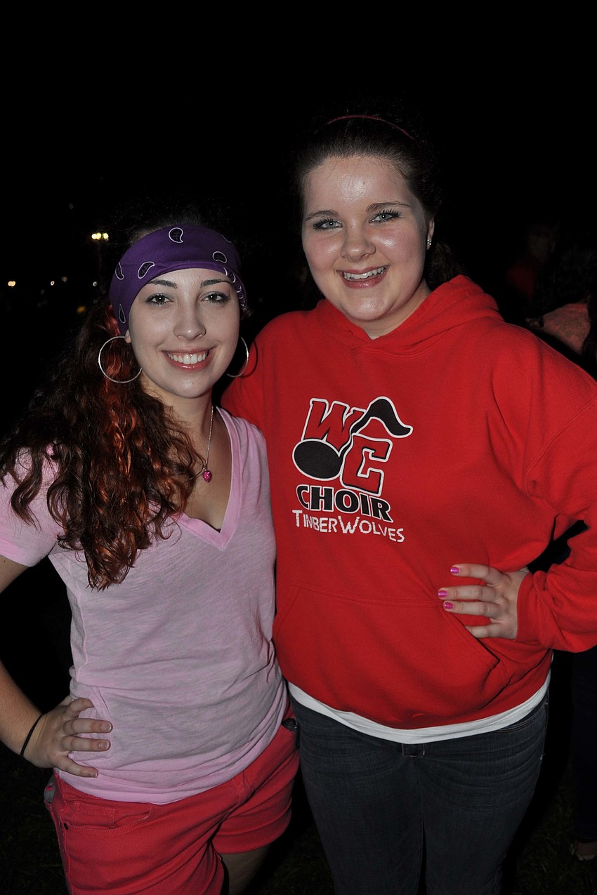 Taylor Dacey and Liberty Hobbs caught up while waiting for the bonfire to get started Oct. 25.