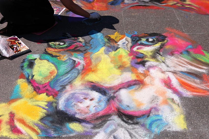 Renee Keady works on her piece, â€œLionâ€.