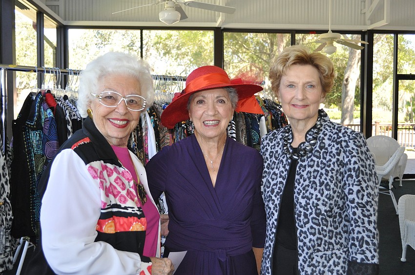 Virginia Olsen, Pat Merchant and Carol Darling looked at some clothes.