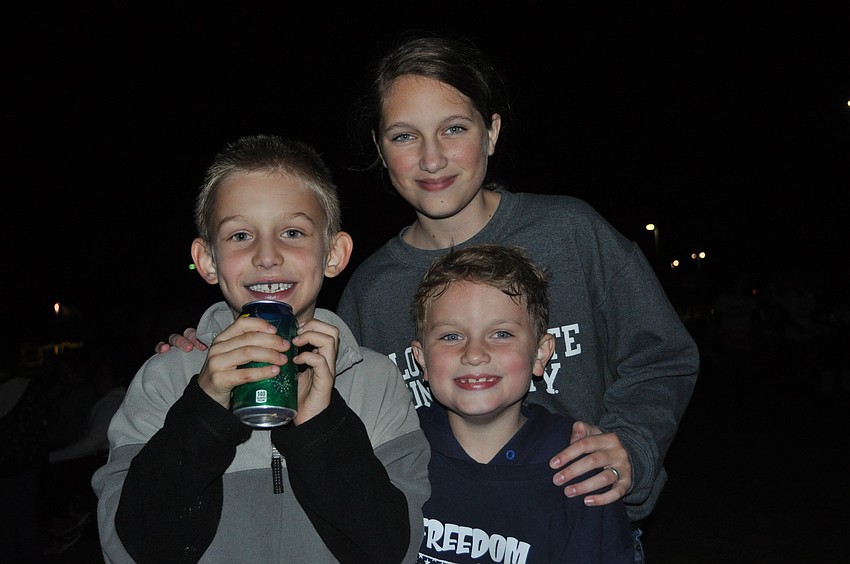 First graders Nathaniel Gruhl and William Cooper with Samantha Cooper