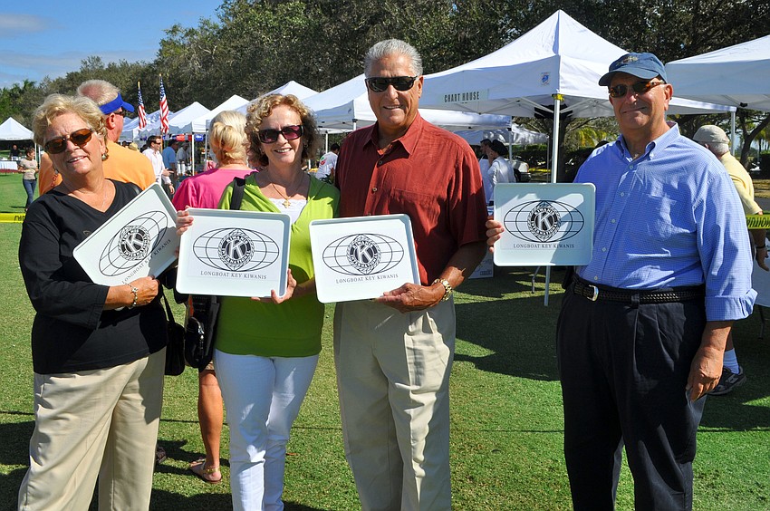 Linda Jackson, Rosie and Steve Petty and Steve Jackson show off their Longboat Key Kiwanis Club trays Saturday, Nov. 17, at the Longboat Key Gourmet Lawn Party.