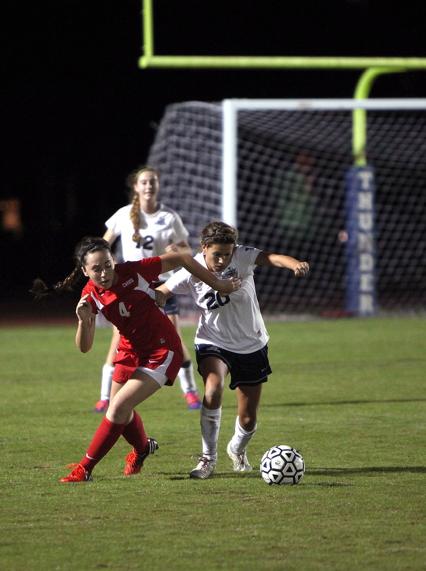 Cardinal Mooneyâ€™s Farrah Nelson, No. 4, and ODAâ€™s Juliet Onufrak, No. 20, fight to get to the ball during Monday nightâ€™s game.