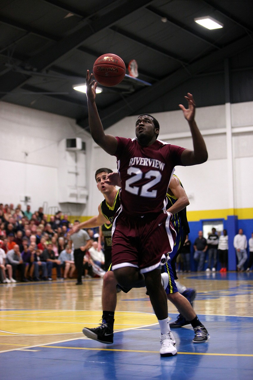 Jeremiah Henderson, No. 22, prepares to take the ball to the hoop Tuesday, Nov. 20, during the game between Riverview and Sarasota Christian at Sarasota Christian.