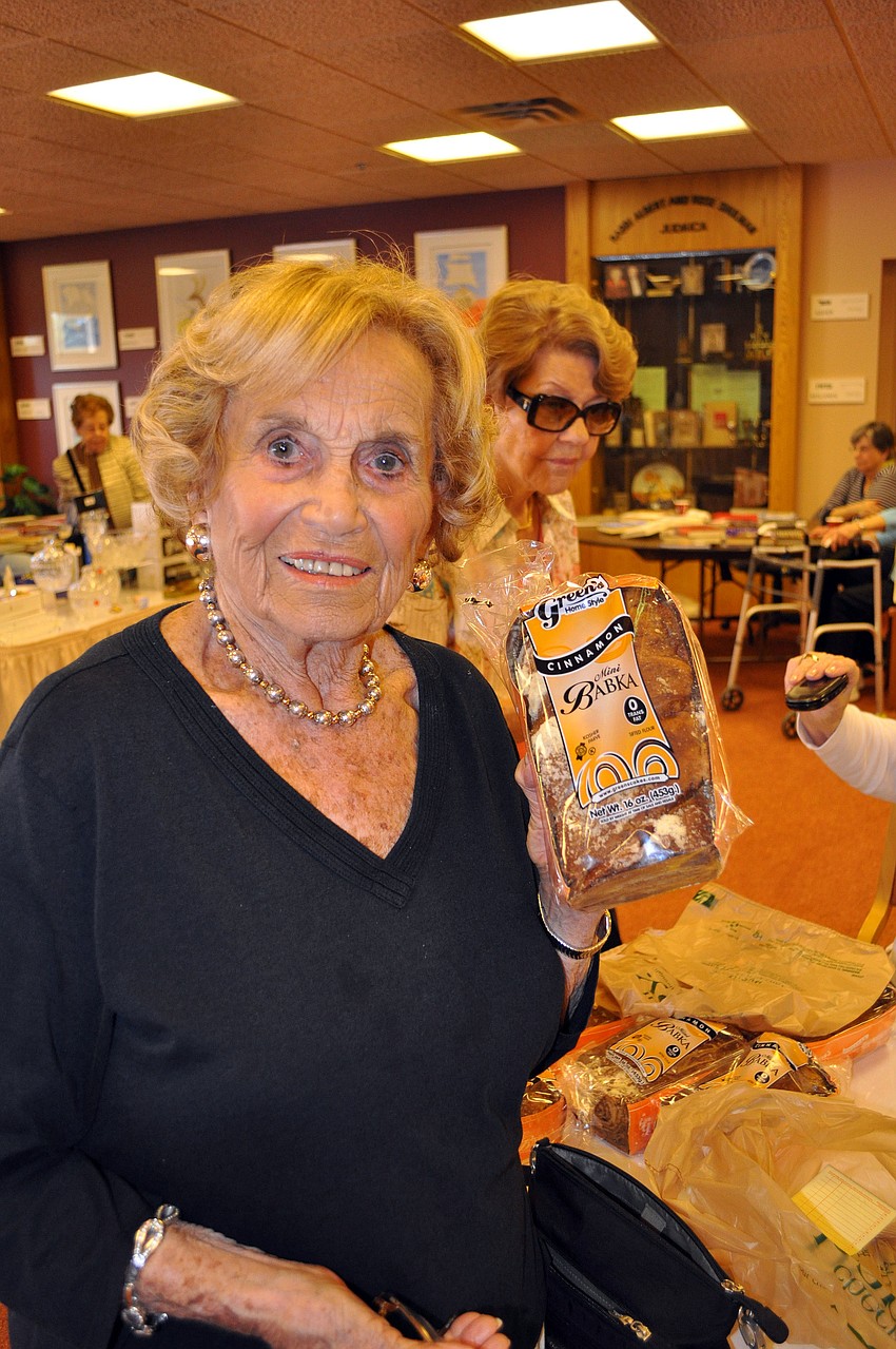 Ruth Orne buys a Babka Sunday, Dec. 2, at Temple Beth Israelâ€™s Holiday Happening.
