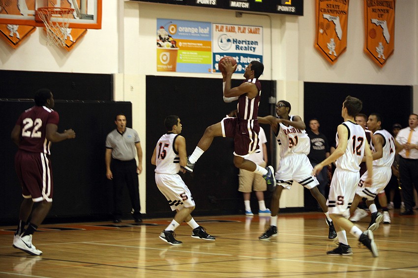 Riverviewâ€™s Austin Walker, No. 30, jumps up to score for Riverview during Riverviewâ€™s game against Sarasota Monday, Dec. 3, at Sarasota High School.