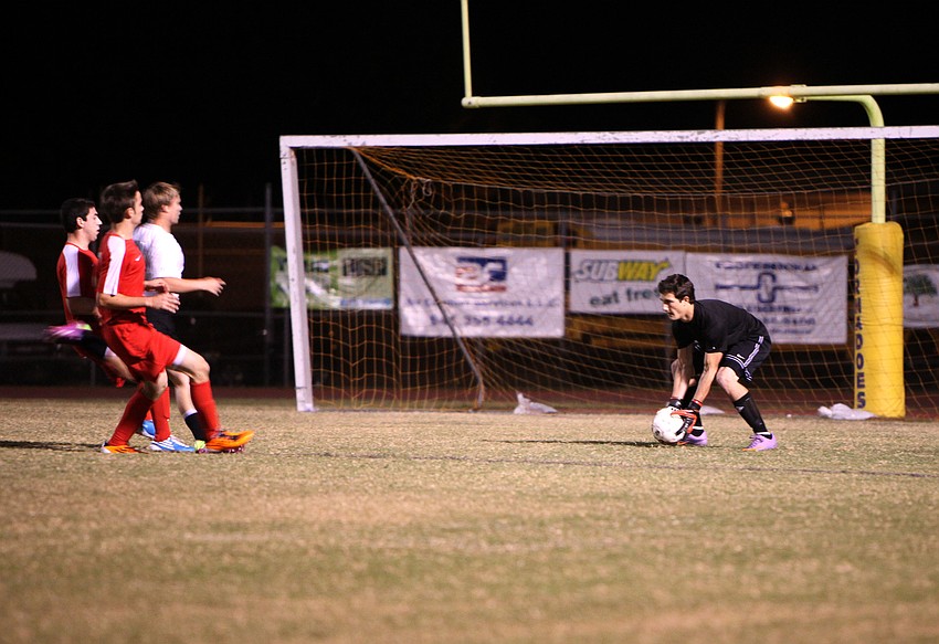Bookerâ€™s Miguel Rebollo, goalie, stops the ball from going into the goal.