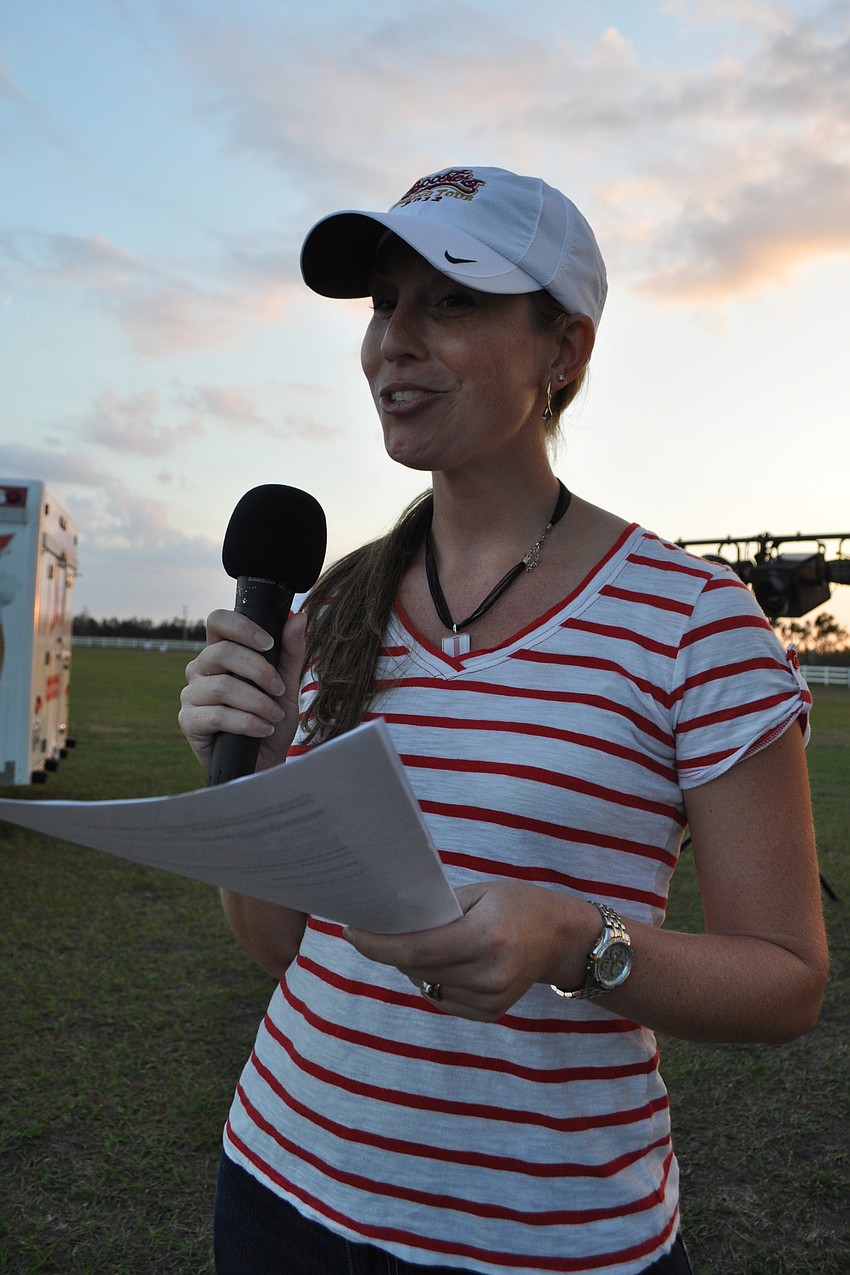 Junior League member Erin Fellows welcomed runners.