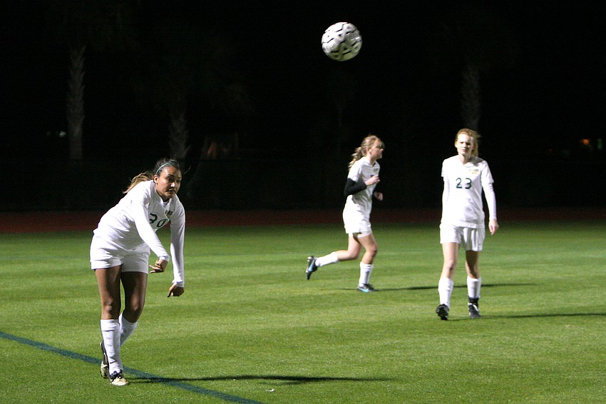Christina Jones, No. 30, throws the ball in from the sidelines.