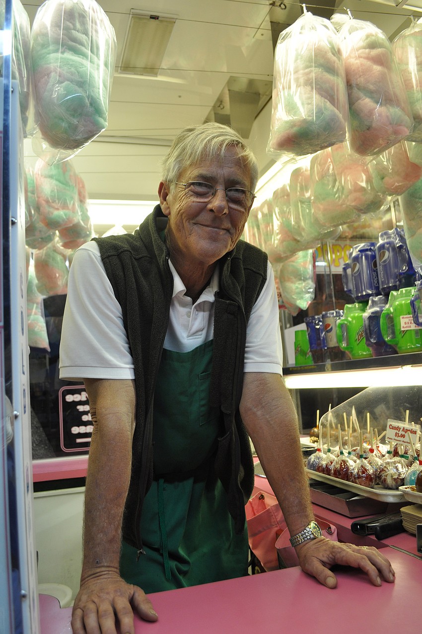John Meigs' display of candy apples and cotton candy lured quite a crowd.