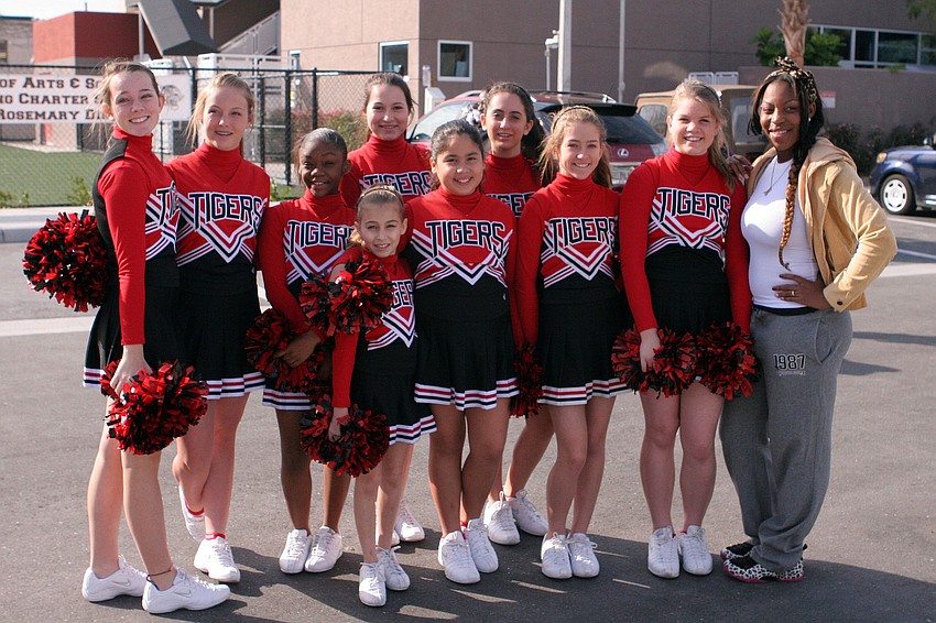 A group of Tiger cheerleaders with one of their coaches, Takira Jenkins