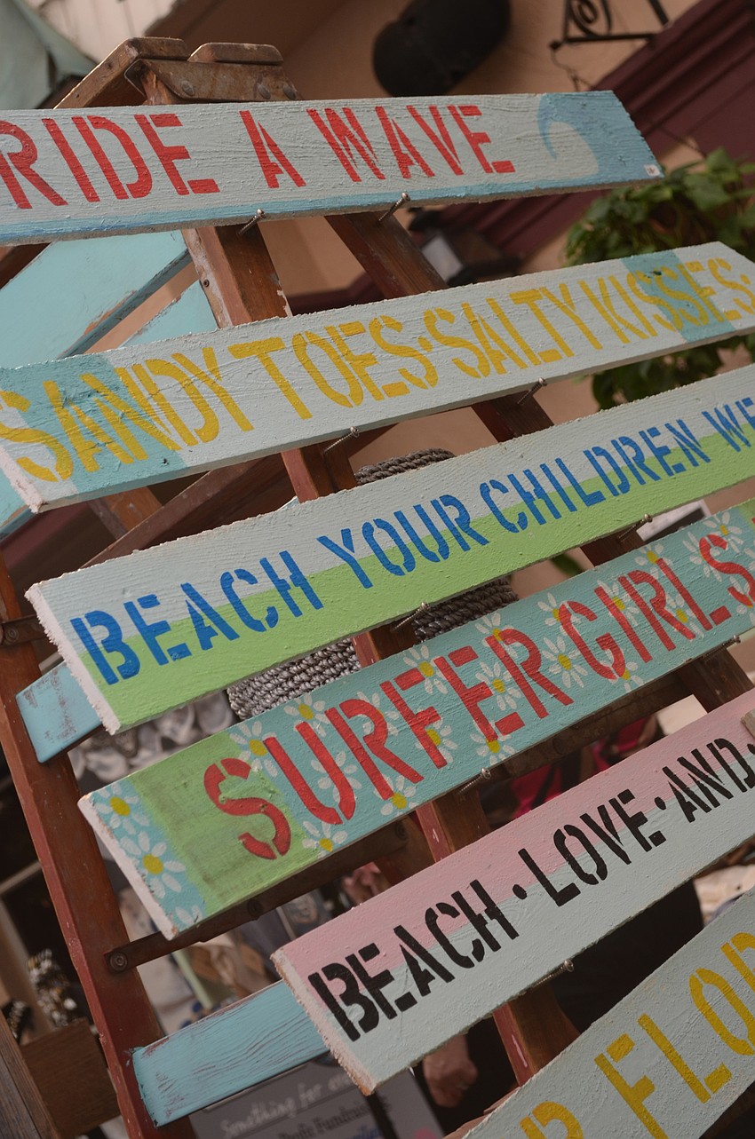 Surf-inspired signs were displayed and on sale at the event.