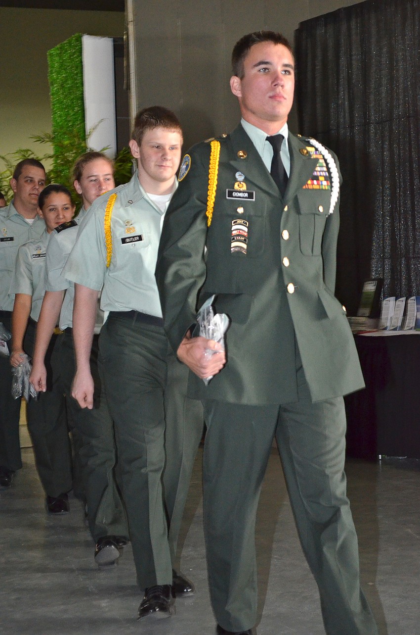 Sarasota Military Academy cadets handed out dog 
Goodwill dog tags to guests.