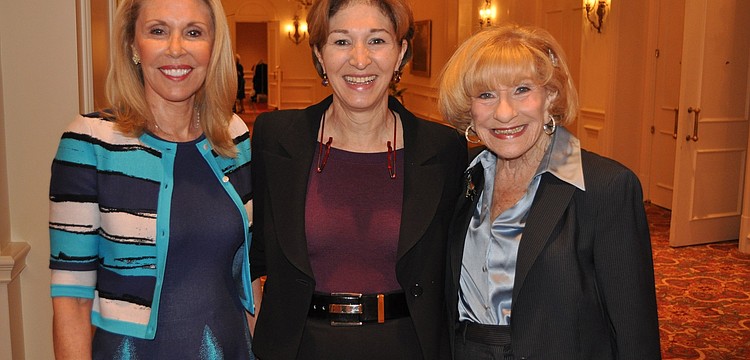 Chairwomen Barbara Ackerman and Flori Roberts pose with guest speaker Anne-Marie Slaughter, center.