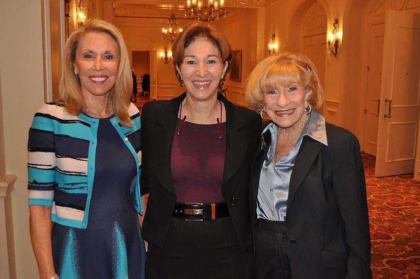 Chairwomen Barbara Ackerman and Flori Roberts pose with guest speaker Anne-Marie Slaughter, center.