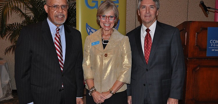Ambassador James Joseph, Roxie Jerde, president and CEO, and Phil Delaney, board chair