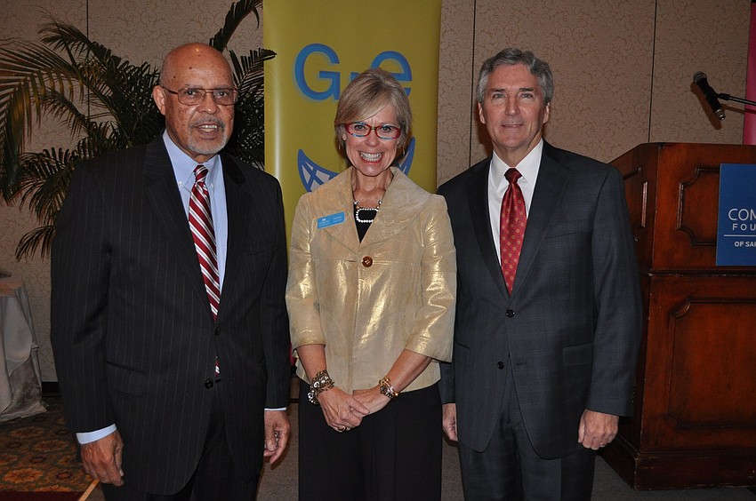 Ambassador James Joseph, Roxie Jerde, president and CEO, and Phil Delaney, board chair