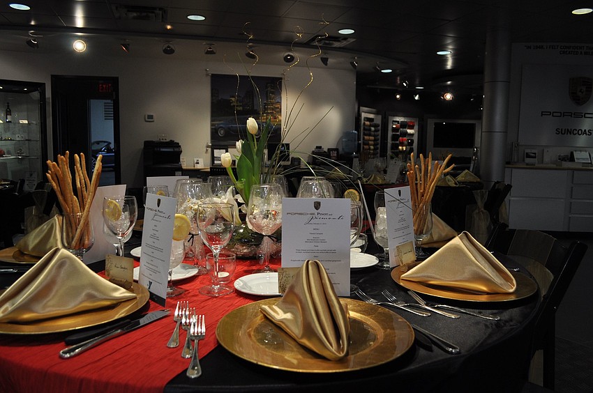 The tables were red and gold in color with Porsche wine glasses filled with candies as souvenirs.