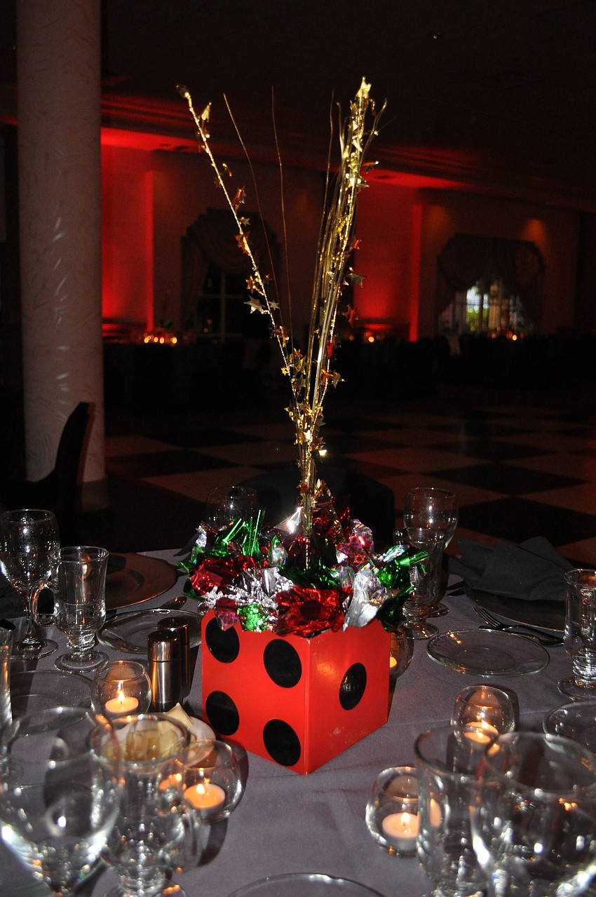 A red dice box with sparkly strands were used as the centerpieces on each of the tables.