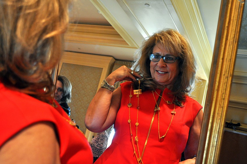 Danielle Smotkin tries on a necklace by Zariin.