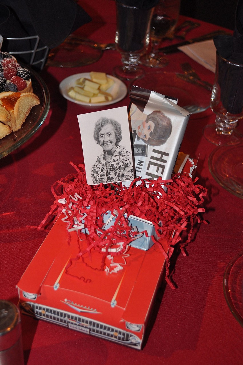 Each table had cars with photos of the honorees.