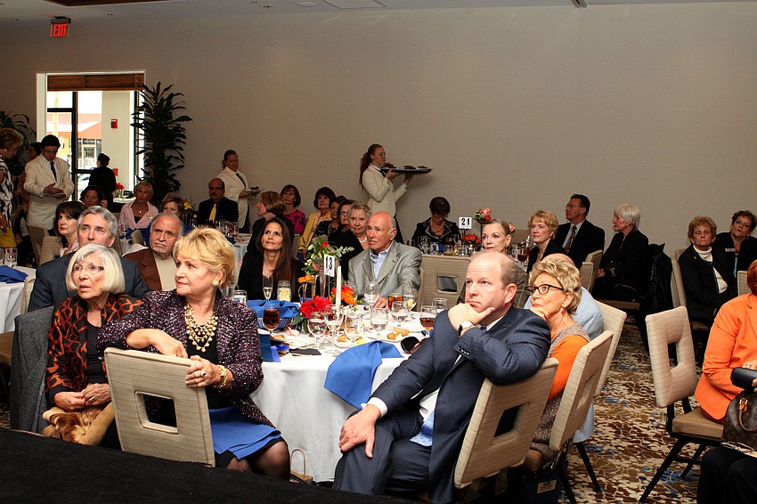 People listen intently as Mr. Hill talks to the crowd.