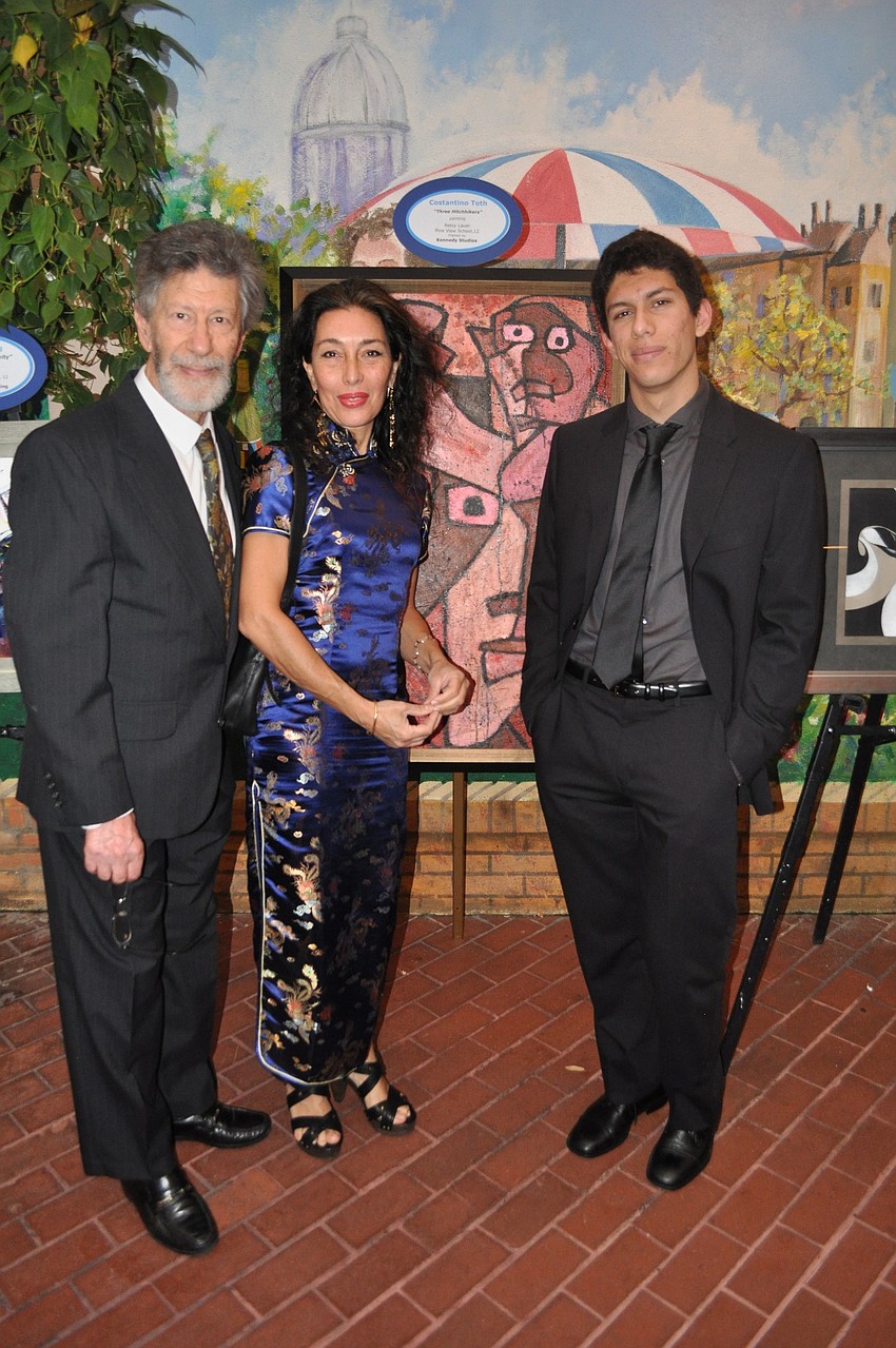 Constantino Toth with his piece â€œThree Hitchhikersâ€ and his parents Luigi and Angela Toth.