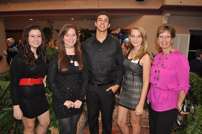 Sarasota High Schoolâ€™s Alexis Donson, Madison Baum, Kale Votour and Kali Karcher with their art teacher Debra Markley.