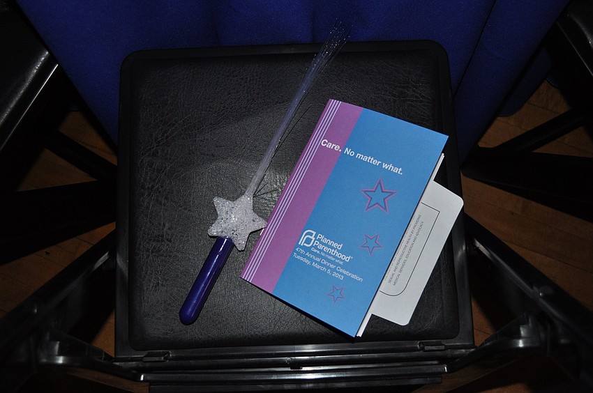 Each guest received a glow star wand and a program.