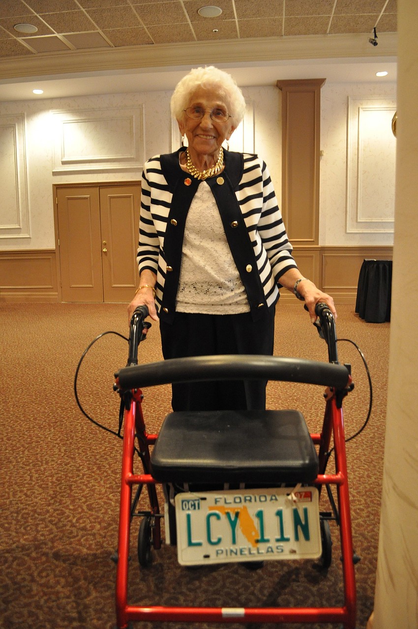 Frances Gower with her walker that features he last license plate from â€™97.