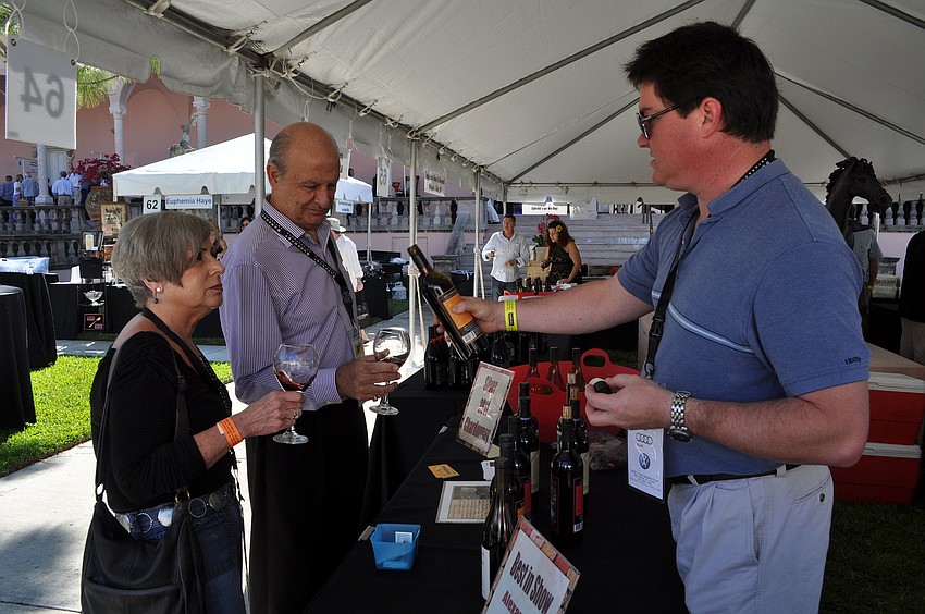 Harry Wetzel pours wine for Lois and Bob Guide