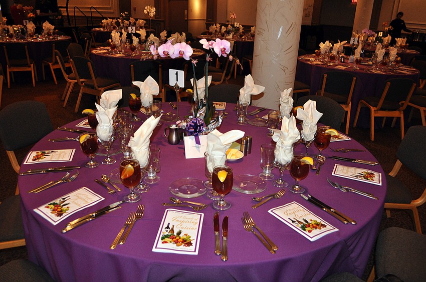 All the tables had purple orchids as the centerpieces and purple table cloths.