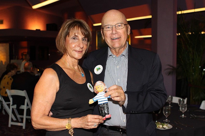 Jean Griffin and Bob Hanson pose with their granddaughterâ€™s Flat Ella