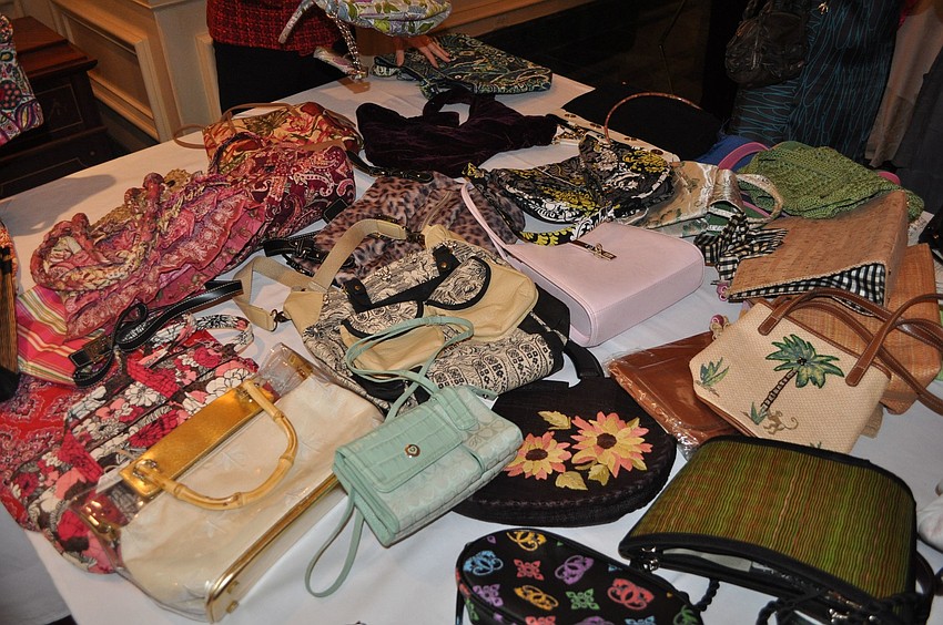 A table full of designer purses.
