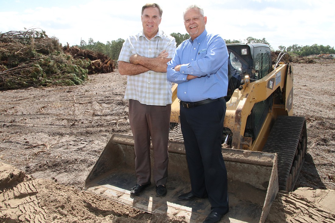 JimJett.com. Bruce Grady, left, will open his $7.8 million Diplomat RV & Boat Storage in Cape Coral in September. Andy Powell, right, with Wright Construction Co., is  one of the investors.