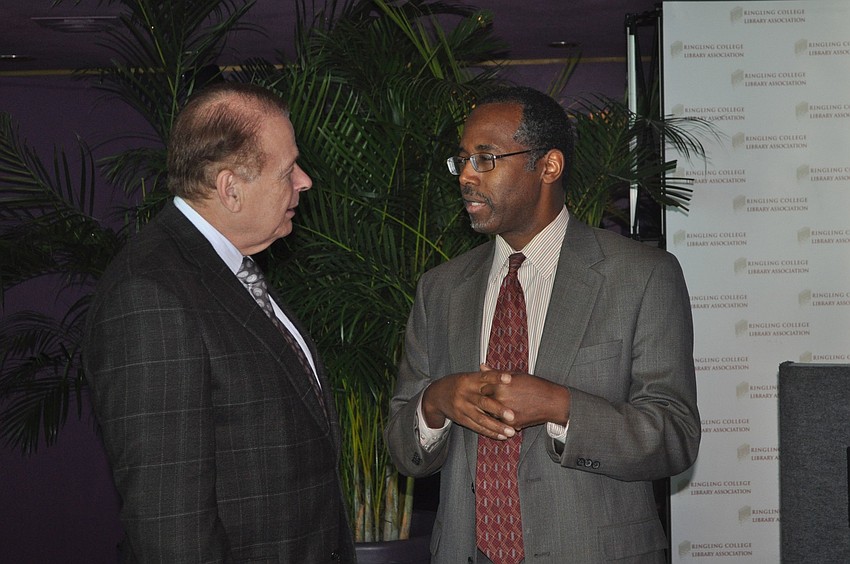 Dr. Larry Thompson talks with guest speaker Dr. Benjamin Carson