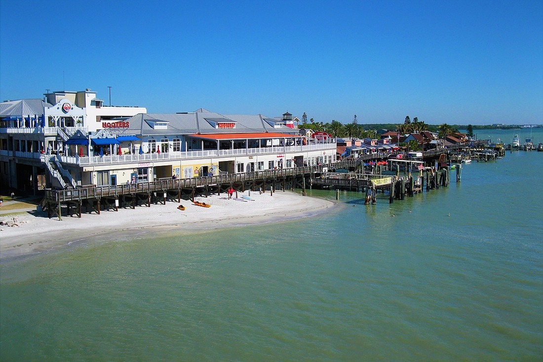 COURTESY PHOTO Aegon USA has owned the Marina at John&#39;s Pass for the past six years. The popular tourist  destination is on the market now for $18.5 million