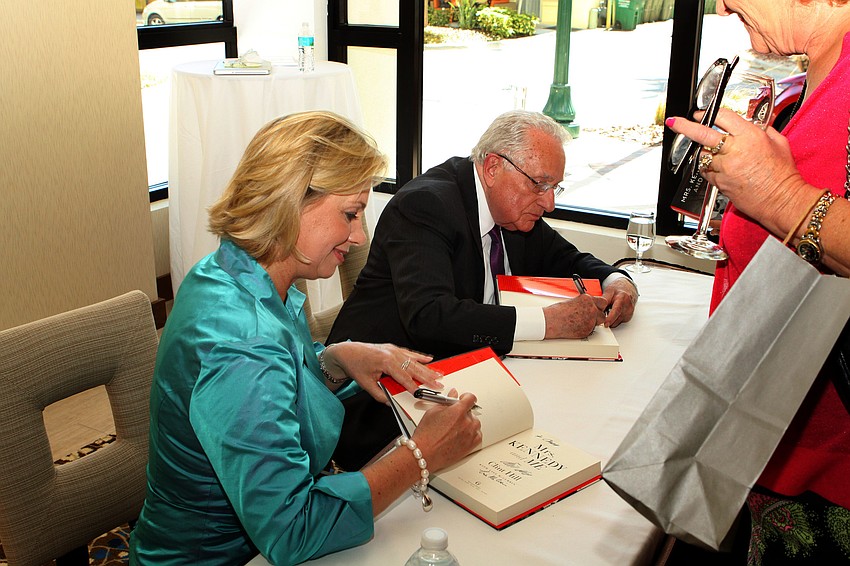 Lisa McCubbin and Clint Hill signed their book following their presentation.