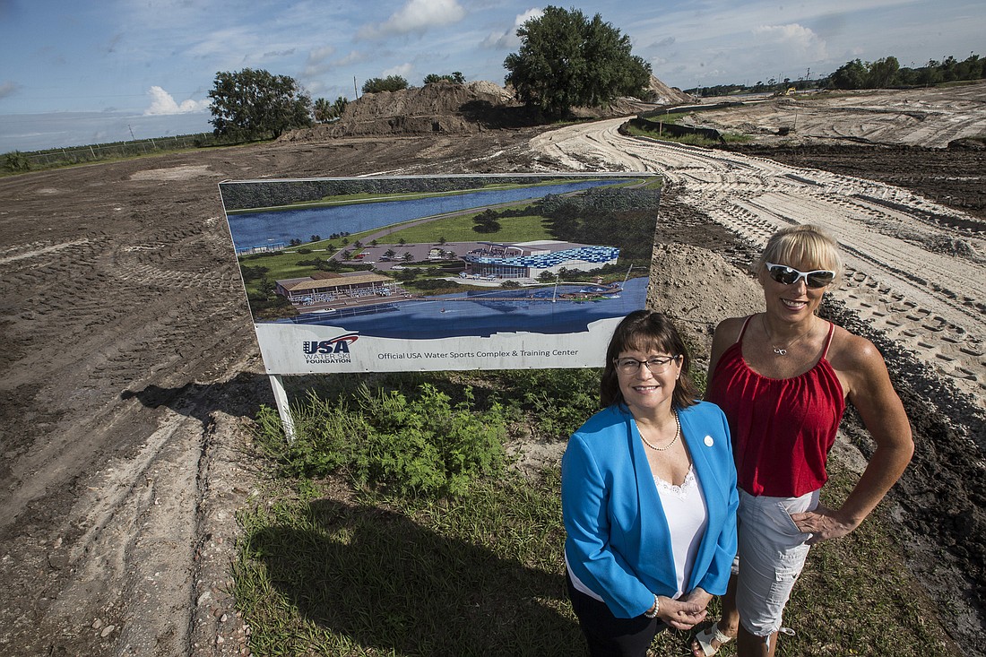 Tracy Garcia, left, economic development manager for Visit Central Florida stands with Tracy Mattes, executive director of the USA Water Ski and Wake Sports Foundation at the entrance to the Lake Myrtle Water Sports Complex.