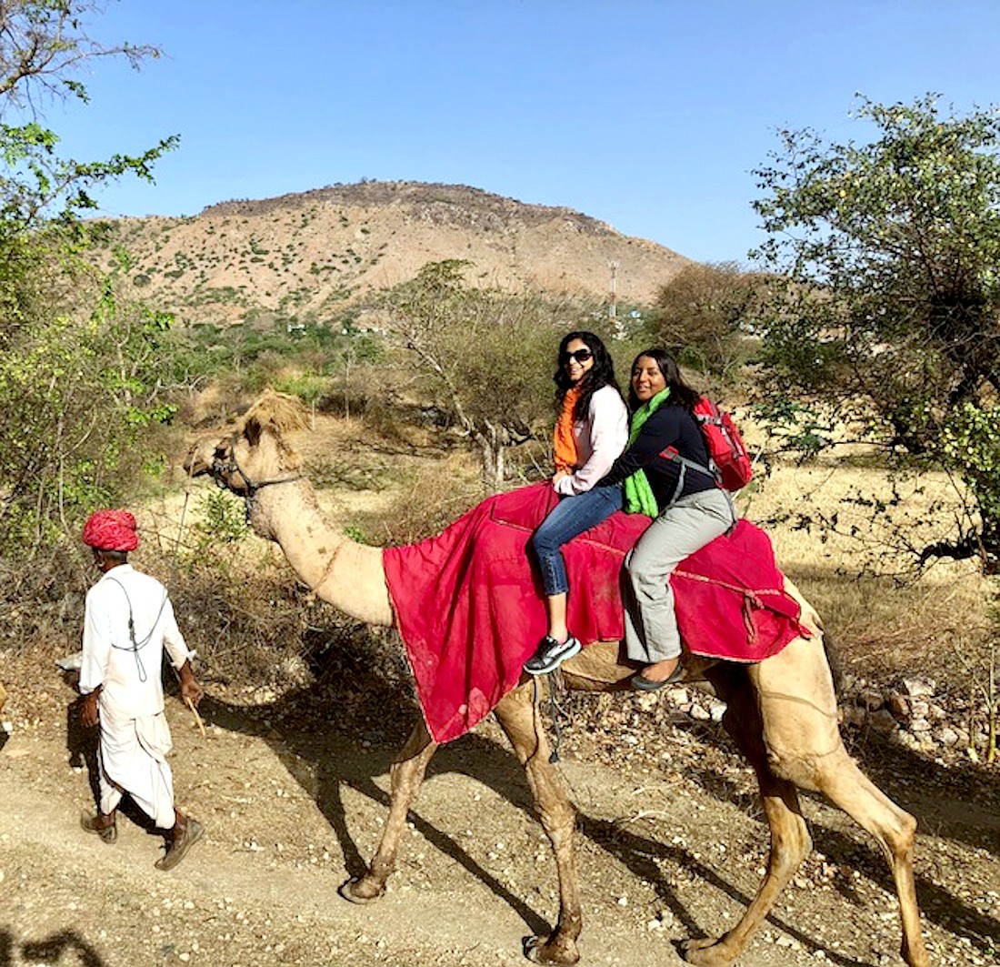 Shirisha Vallarapu rides on the back of a camel to visit sites in northern India.