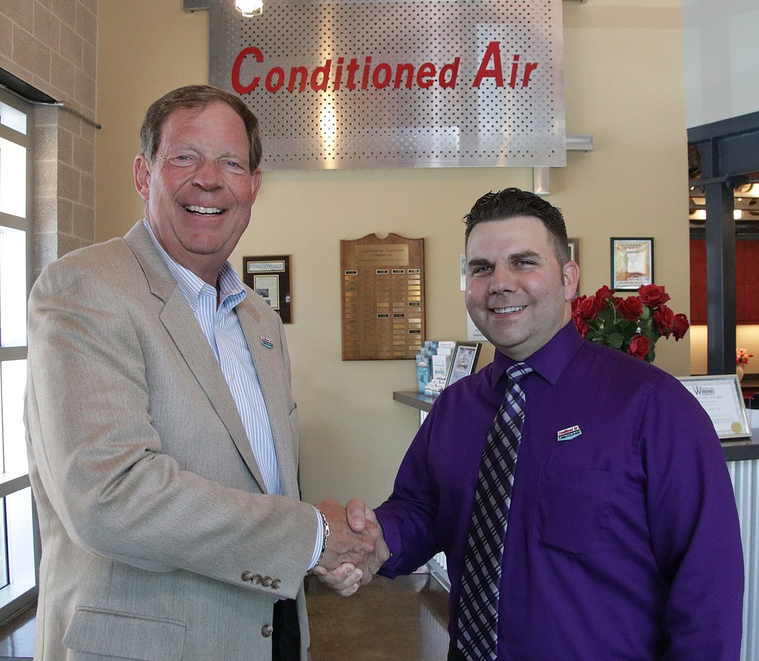 Theo Etzel, left, has handed the reins of Conditioned Air to new President and CEO Tim Dupre, who started with the company 21 years ago as a novice installer.