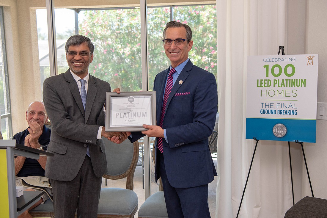 Courtesy. U.S Green Building Council President and CEO Mahesh Ramanujam, left, visited Bradenton recently to mark 100 LEED Platinum certified homes in the Mirabella community, developed by Marshall Gobuty, right.