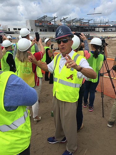 John Schuerholz leads the crowd in singing "Take Me Out to the Ballgame" during the topping off ceremony for the team&#39;s new spring training stadium under construction in North Port. Photo by Andrew Warfield