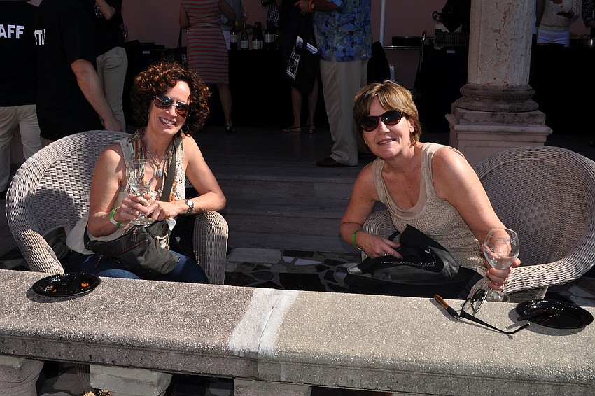 Vicky Weis and Mary Frowley made themselves comfortable while drinking wine and trying food at the Grand Tasting.