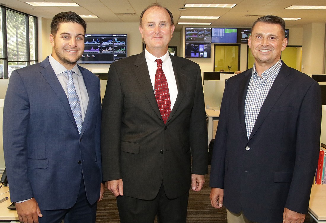 From left, Flightdocs COO Rick Heine, Founder and CEO Jeff Heine and Bonita Springs Mayor Peter Simmons at the grand opening of the new Flightdocs Technology Center. Photo by Jim Jett
