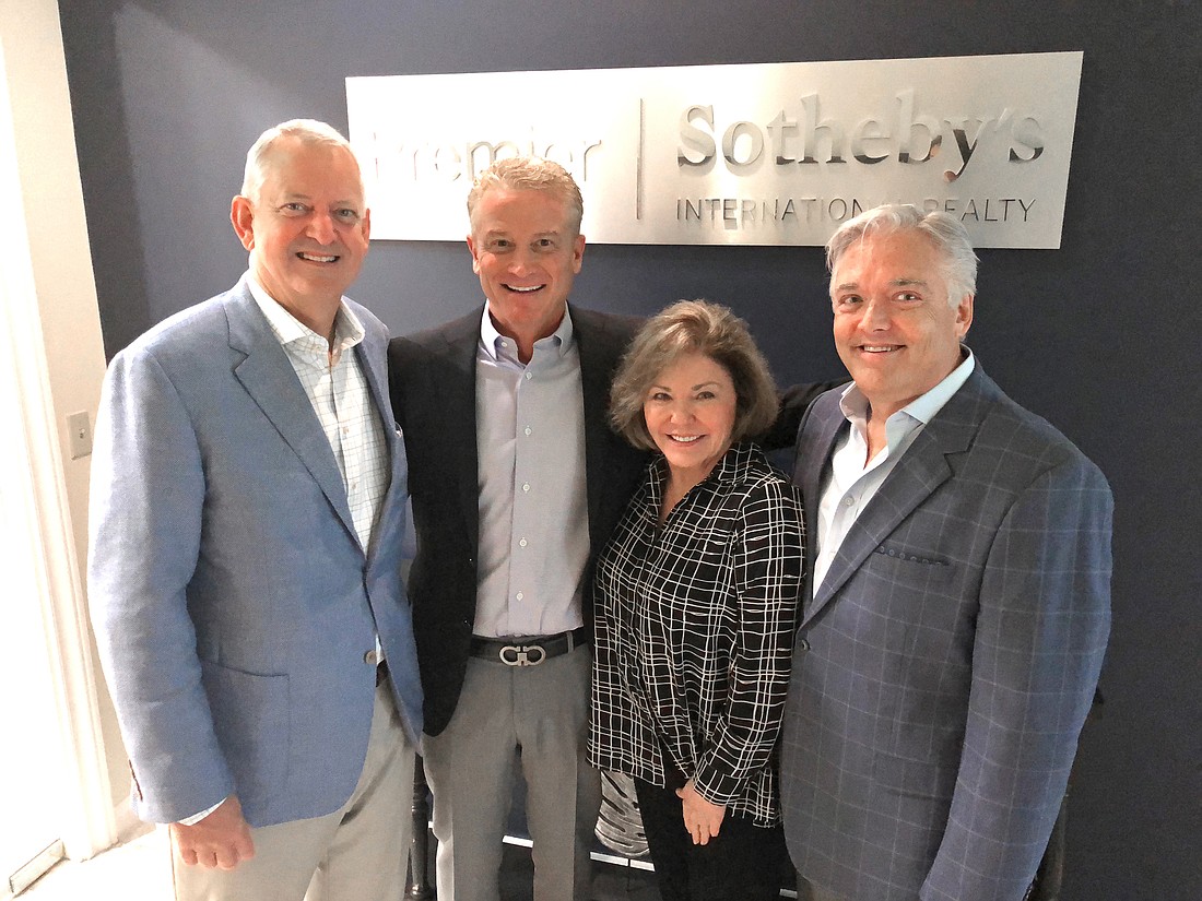 From left,Â Premier Sothebyâ€™s International Realty President Budge Huskey and Don Winkler with Premier Sothebyâ€™s Judy Green and Tom Bryan.